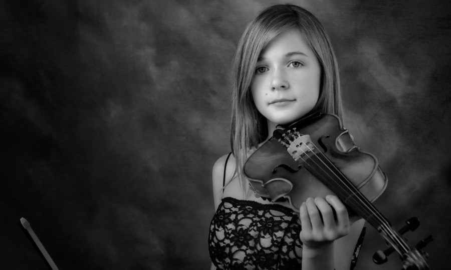 A black and white studio portrait created by Isabelle Guillen in