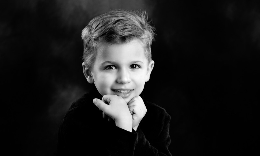 A black and white studio portrait created by Isabelle Guillen in