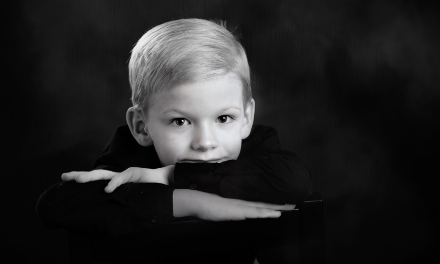 A black and white studio portrait created by Isabelle Guillen in