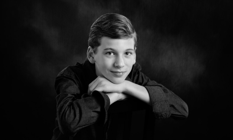 A black and white studio portrait created by Isabelle Guillen in