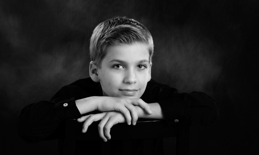 A black and white studio portrait created by Isabelle Guillen in