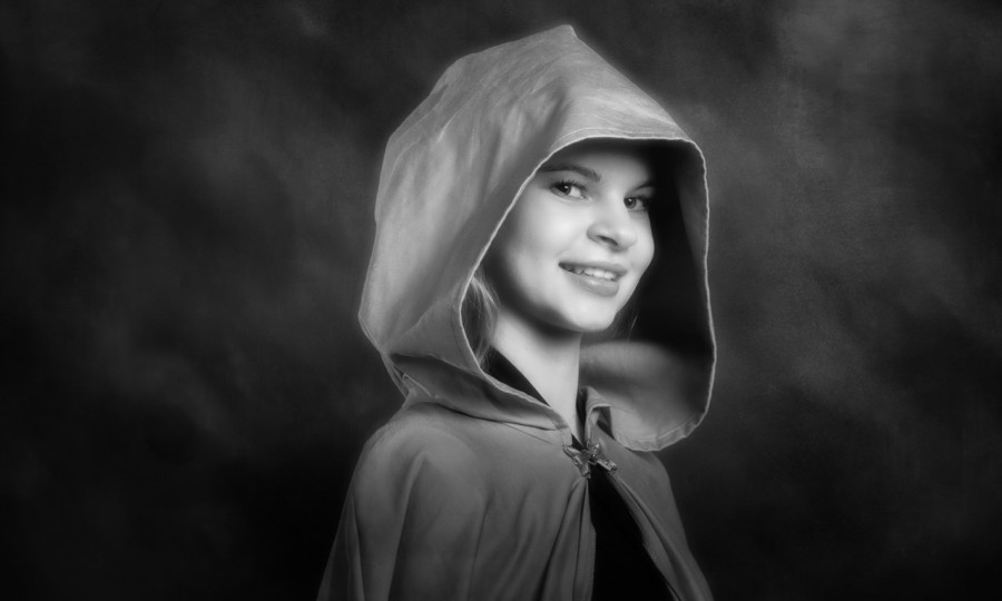 A black and white studio portrait created by Isabelle Guillen in