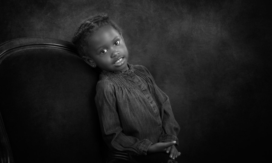 A black and white studio portrait created by Isabelle Guillen in