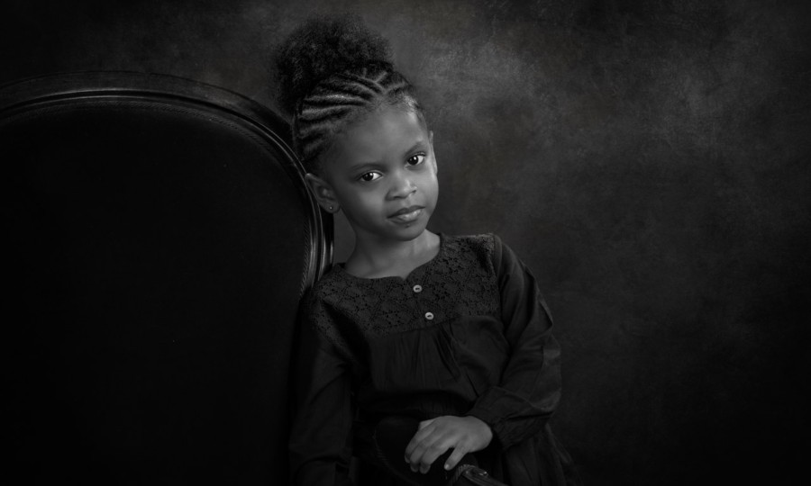 A black and white studio portrait created by Isabelle Guillen in
