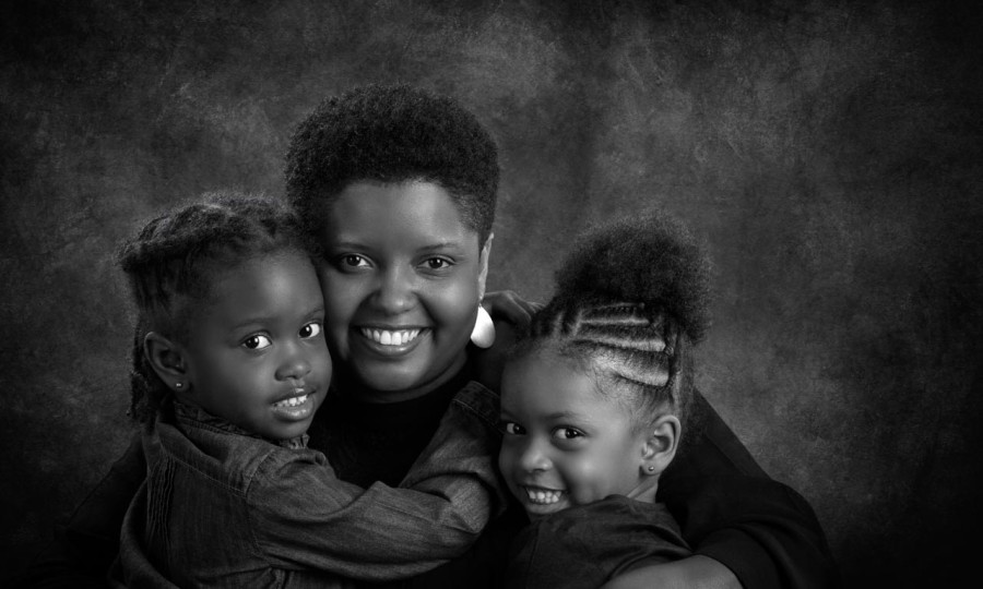A black and white studio portrait created by Isabelle Guillen in
