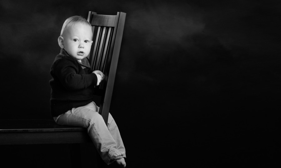 A black and white studio portrait created by Isabelle Guillen in